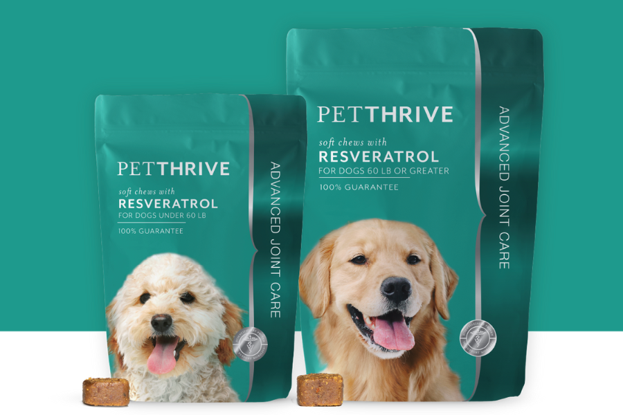 Two teal PetThrive packages of Resveratrol soft chews for joint care for dogs, with images of a small and large dog.